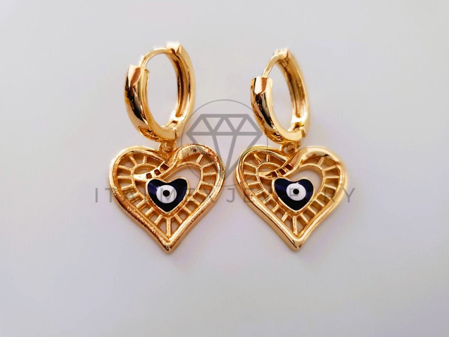 Arete de Lujo - 104641 - Huggie de Corazon y Ojo Turco Oro Laminado 18K